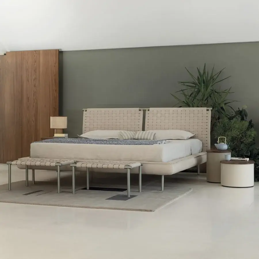 Elegant Cierre1972 Jared bench with a light beige handwoven leather seat and light gray metal legs
