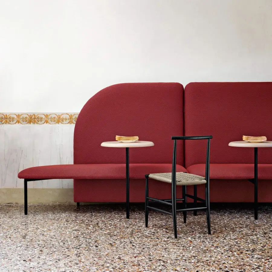 Exceptional Miniforms Marino bench with organically shaped seating upholstered in deep red textured textile and thin dark legs