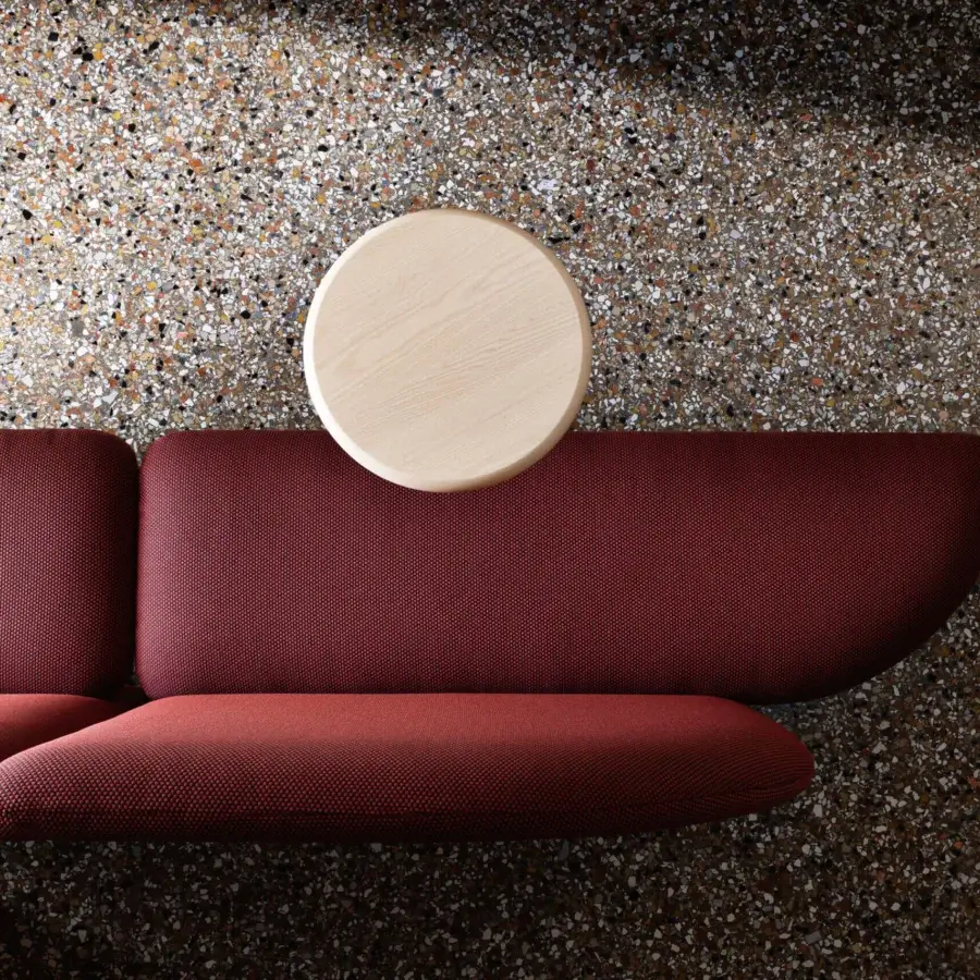 Superior Miniforms Marino bench with organically shaped seating upholstered in maroon patterned textile and light-wood tables