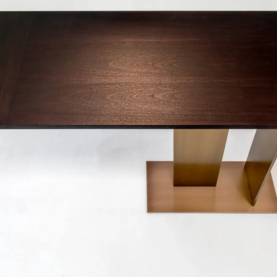Distinguished Casa Casati Berlino console with wood top showcasing grain and minimalist metal base in bronze tone with orange lacquer underside