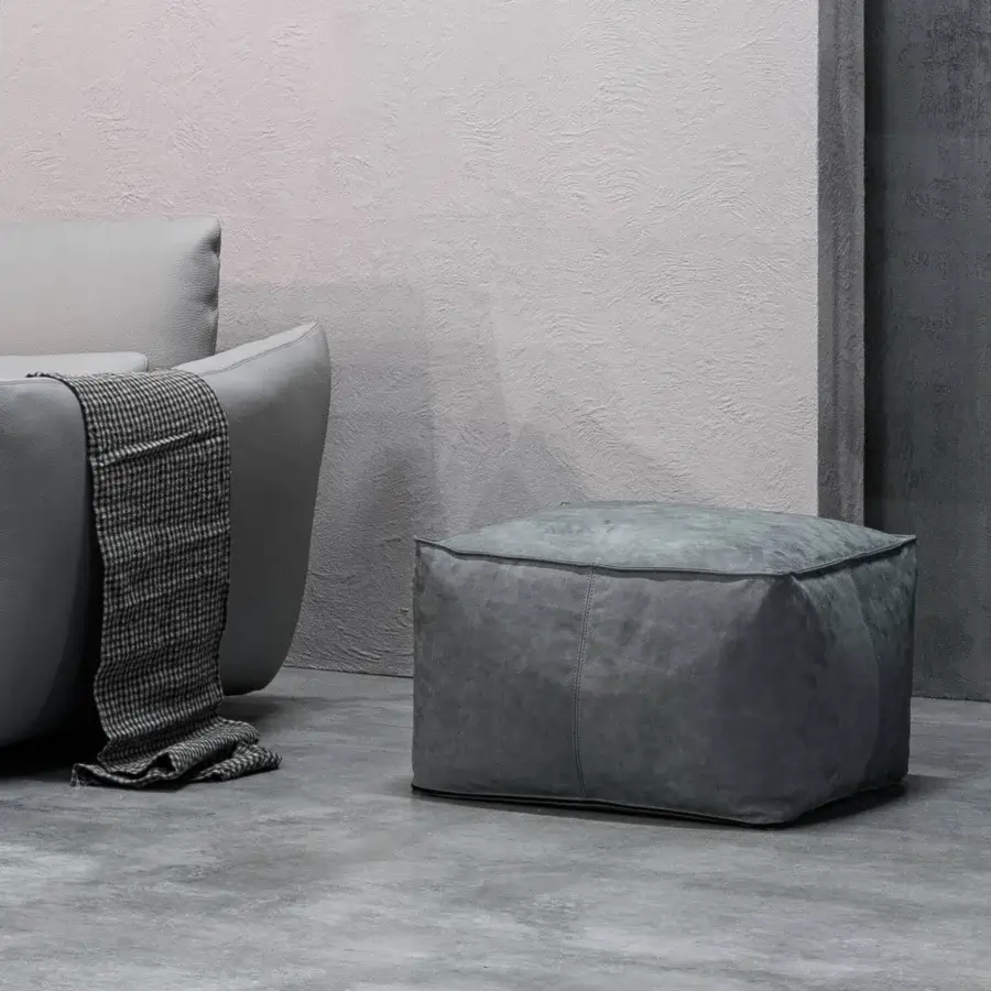 Distinguished Cierre1972 Soft Ottoman, a minimalist ottoman upholstered in gray fabric with a matte finish