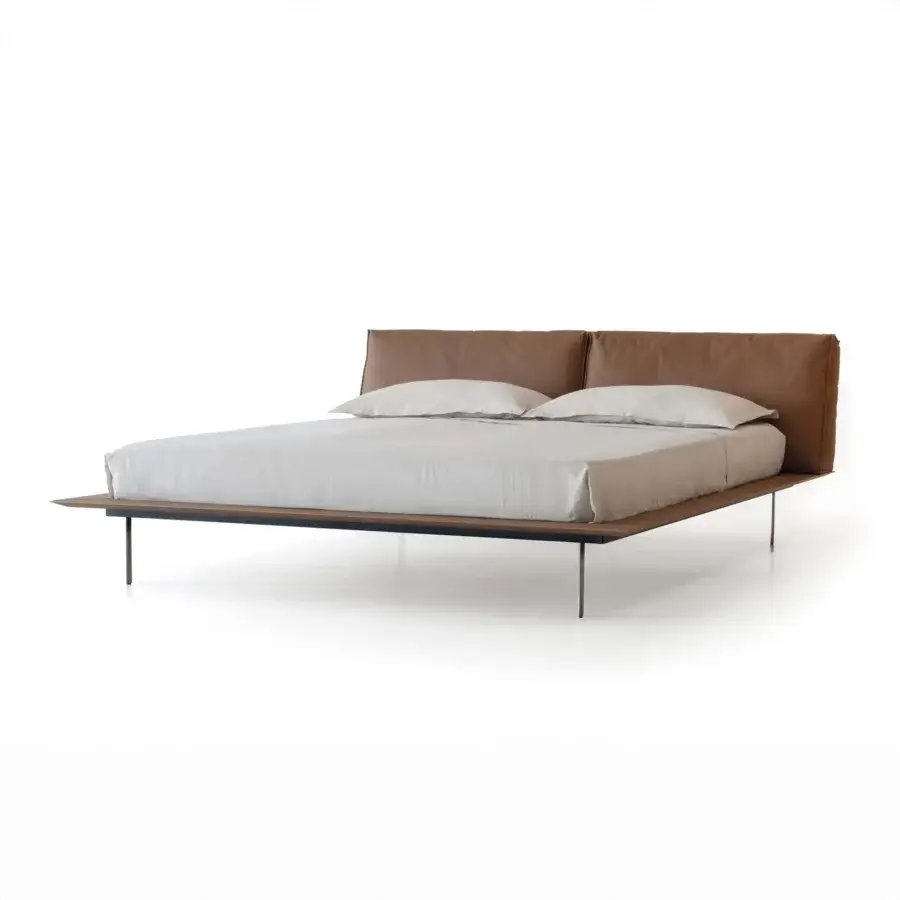 Superior Cierre1972 Vogue Cuoio bed with rich brown leather upholstery and slender dark metal legs