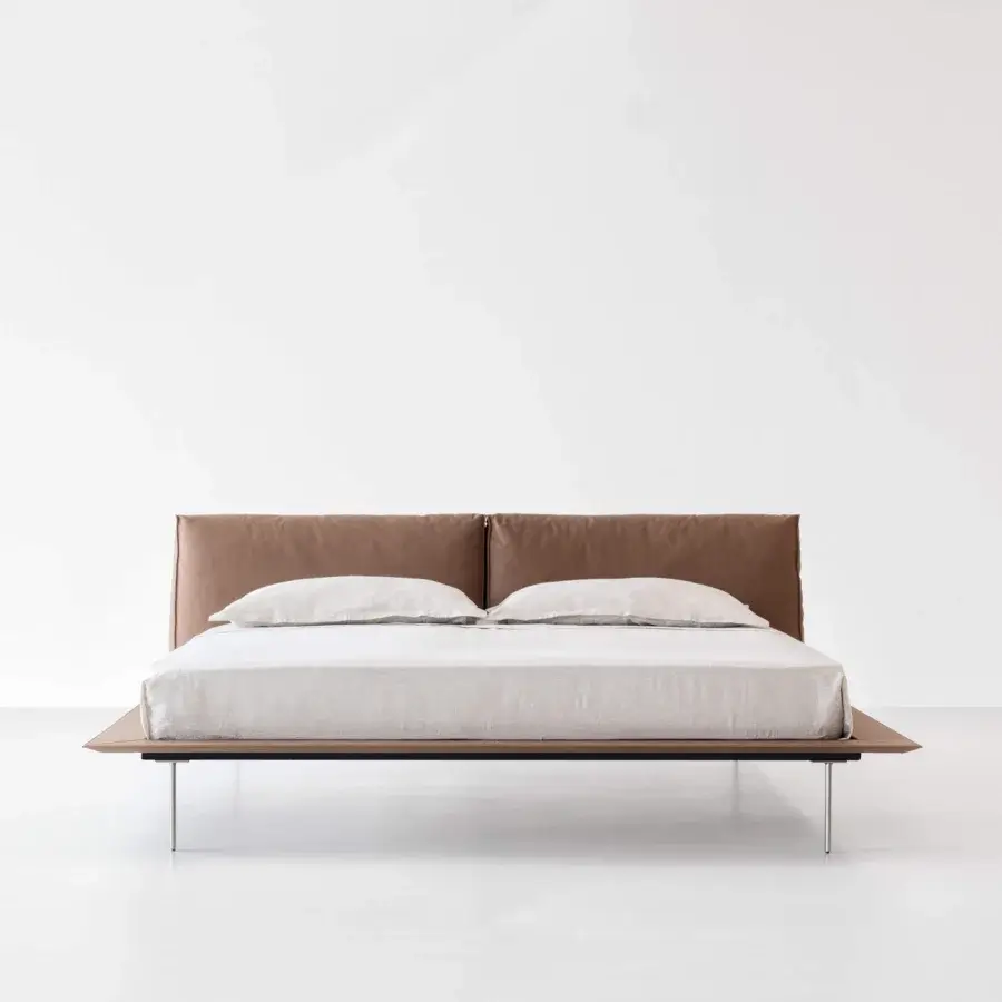 Distinguished Cierre1972 Vogue Cuoio bed with light brown leather upholstery and wood-like finish legs crafted in Italy