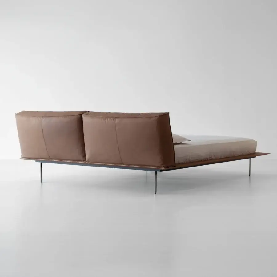 Superior Cierre1972 Vogue Cuoio bed with squared geometry, plush padded headboard, and smooth brown leather upholstery supported by dark metal legs