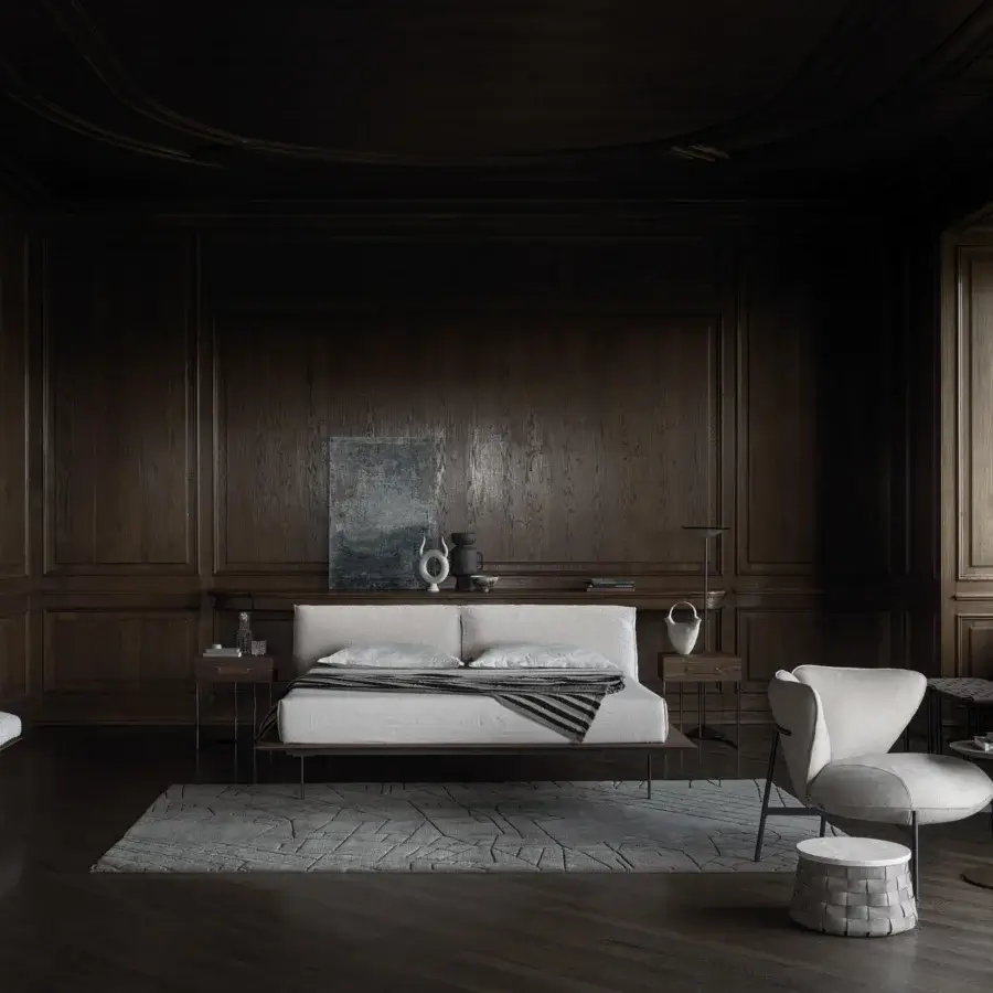 Distinguished Cierre1972 Vogue Cuoio bed with a low silhouette, dark brown wood platform, and light textile upholstered headboard
