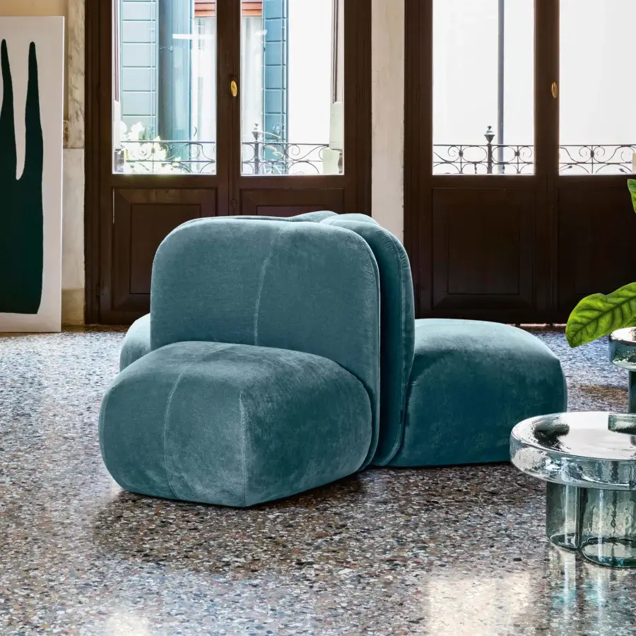Distinguished Miniforms Boterina lounge chair in deep teal textile with matte finish exhibits unique segmented forms and curved padded sections