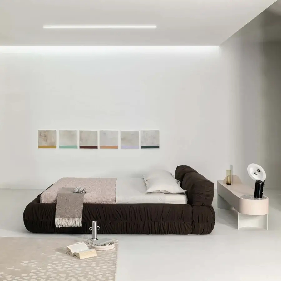 Distinguished Cierre1972 Option bed with dark brown textile upholstery and gathered detailing exhibiting a low profile silhouette
