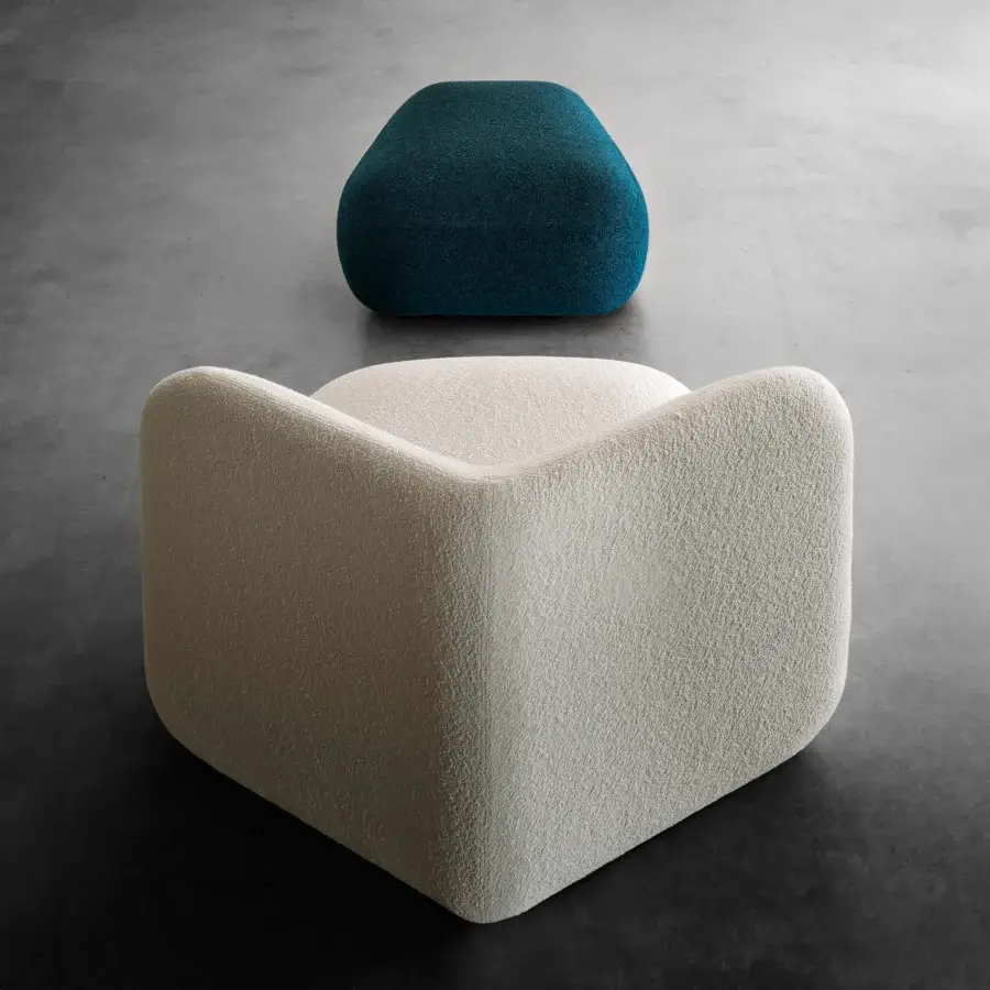 Superior Miniforms Botera ottoman with a squishy seat upholstered in textured light beige textile and a rounded back