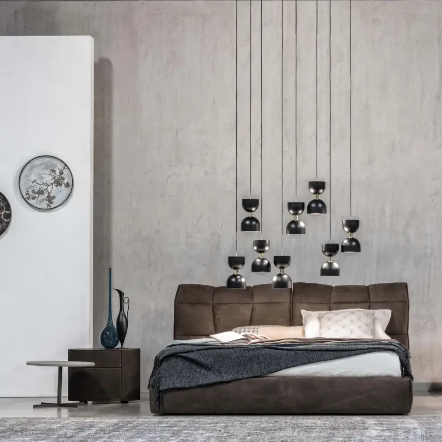 Exclusive Cierre1972 Eva II bed with wide headboard upholstered in soft, brown suede-like textile and adjustable headrest