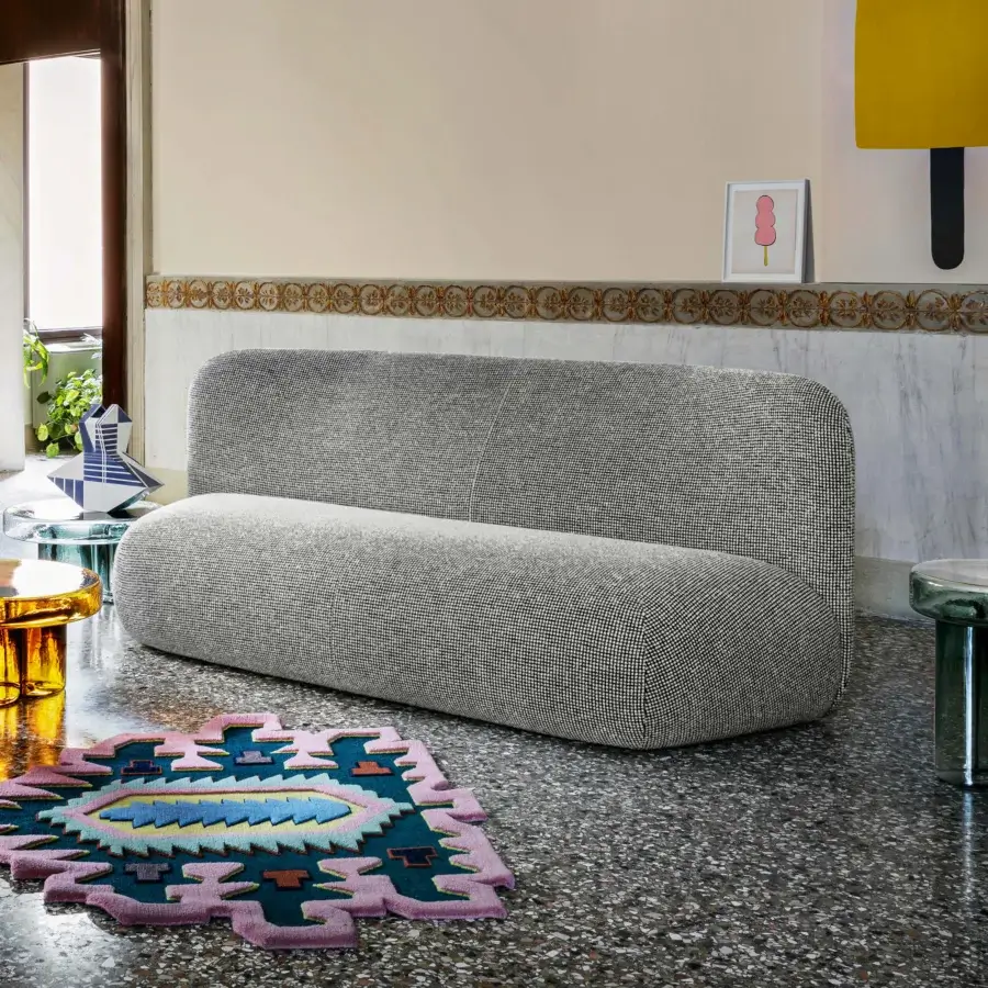 Superior Miniforms Botera sofa, a comfortable modular seating system upholstered in neutral gray textile with curved lines