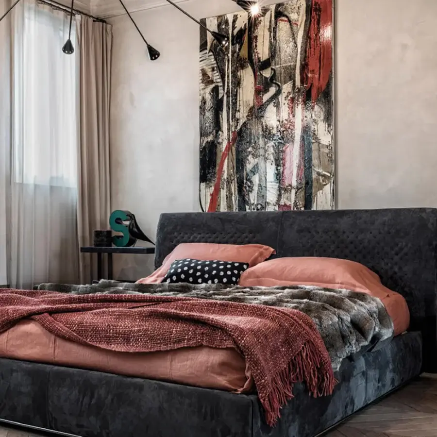 Exceptional Cierre1972 Chandelier bed with dark gray capitonné upholstery and salmon bedding crafted in Italy
