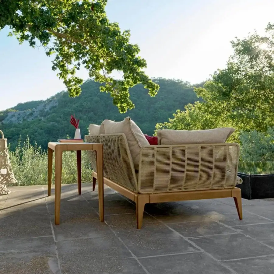 Elegant Talenti Cruise sofa with teak wood framing and woven synthetic rope detailing in light beige cushions