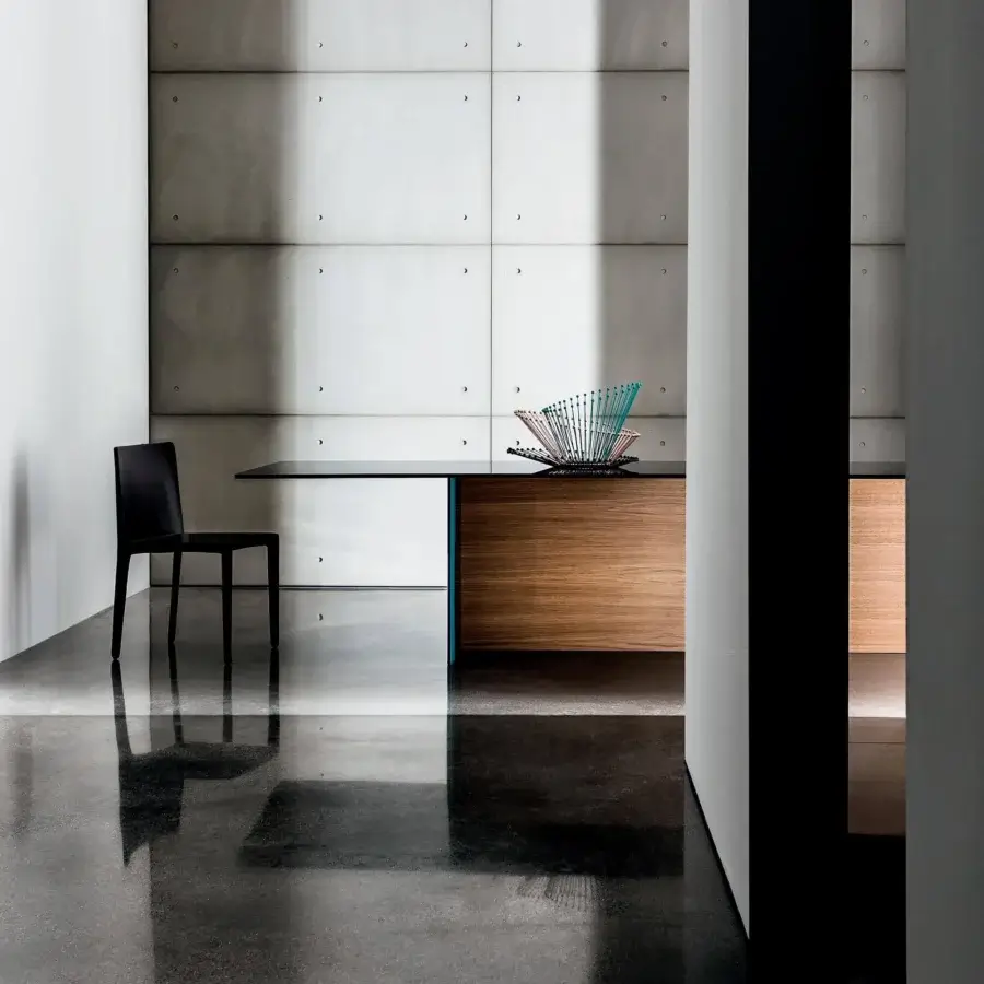 Distinguished Sovet Italia Regolo table with black laminated glass top and uniquely crafted wood base in a clear finish