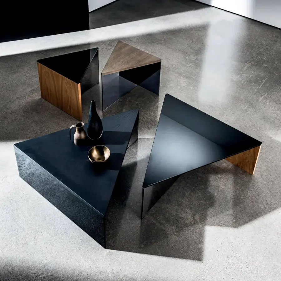 Sophisticated Sovet Italia Regolo table with dark triangular top and geometric base crafted in smoked glass and black lacquered laminated glass