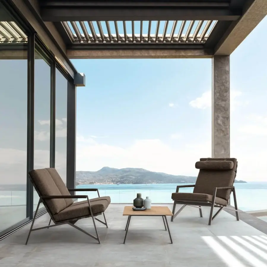 Exceptional Talenti Cottage lounge chair with a reclined posture and rich brown textile upholstery with powder-coated aluminum frame