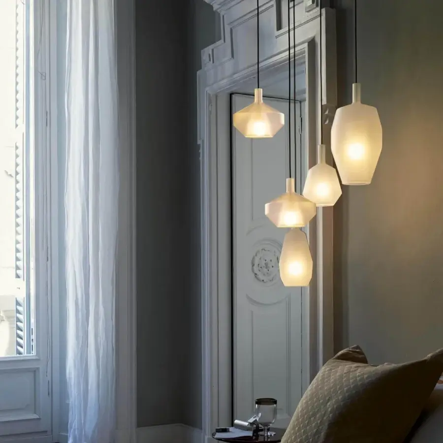 Exceptional Penta MoM suspension lamp crafted in translucent white borosilicate glass with a refined geometric design and thin black cable