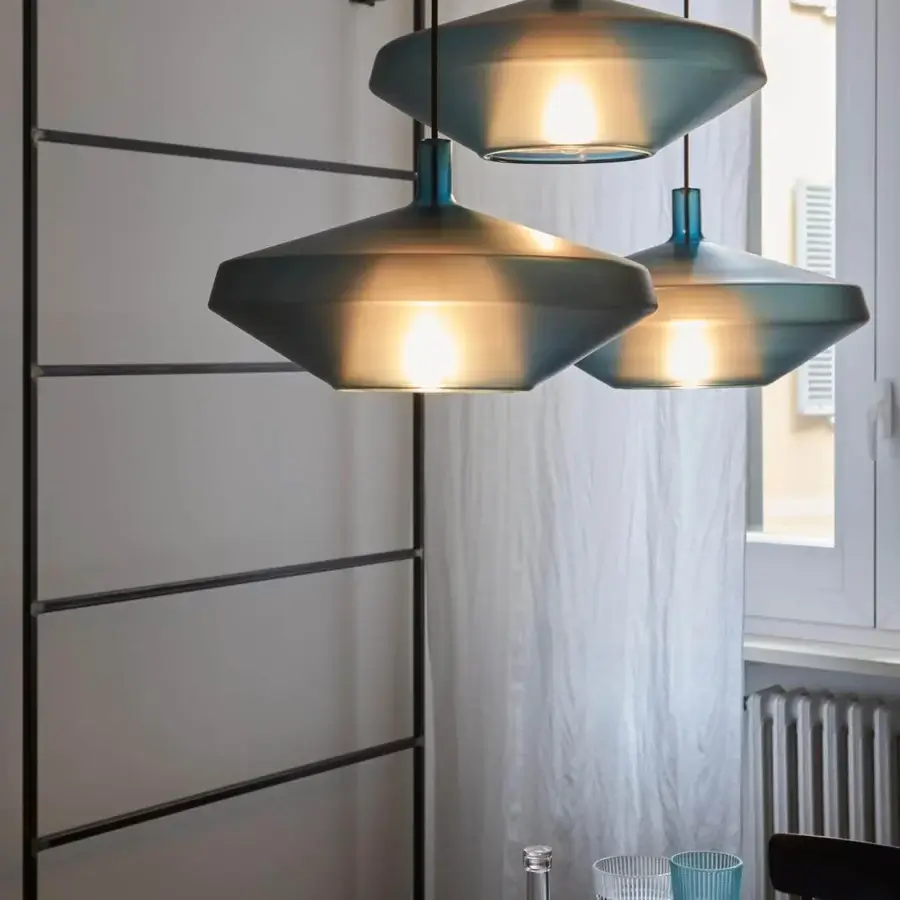 Superior Penta MoM suspension lamp crafted in muted blue-gray borosilicate glass with a flattened conical shade and streamlined form