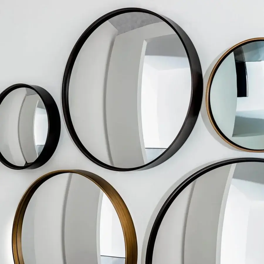 Superior Sovet Italia Sail mirror with a lacquered metal frame and burnished brass finish creating artful reflection