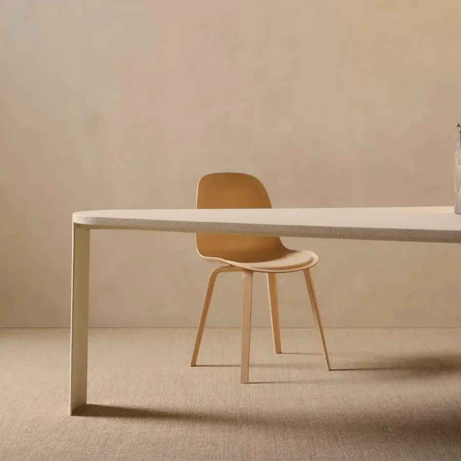 Distinguished MDF Italia Press chair crafted in bleached beech plywood with a light tan shell and four-legged base
