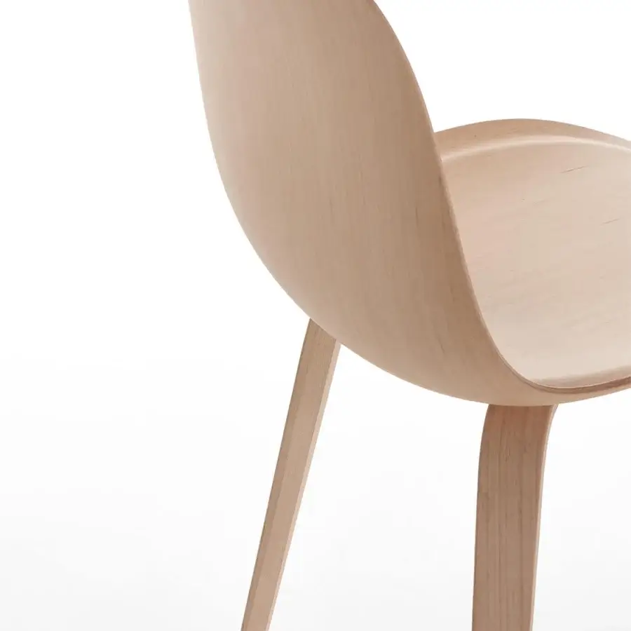 Distinguished MDF Italia Press chair in bleached beech plywood with a graceful curved form and light beige hue