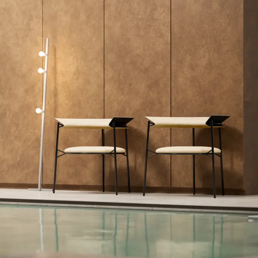 Distinguished MDF Italia Cantle lounge chair with embracing backrest crafted in light beige fabric and graphite grey powder-coated steel