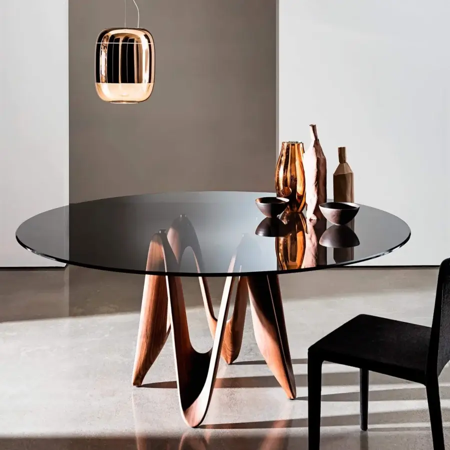 Sophisticated Sovet Italia Lambda table with transparent tempered glass and sculpted Canaletto walnut wood base crafted with a smooth finish