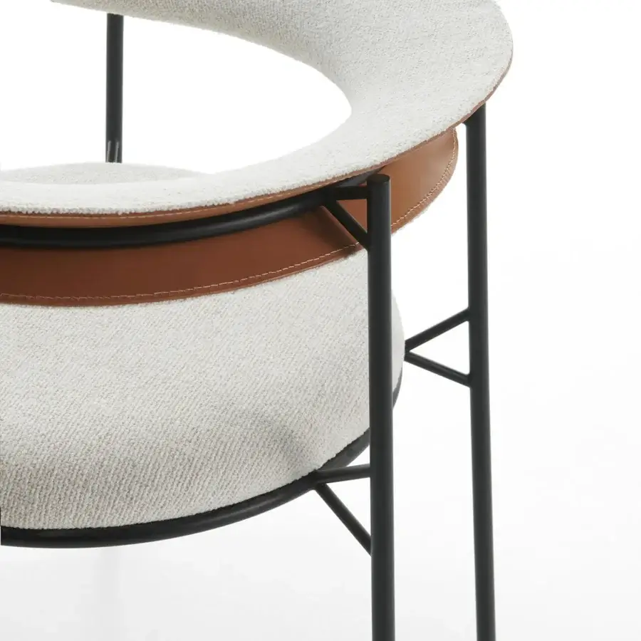 Captivating MDF Italia Cantle lounge chair with curved backrest upholstered in light beige textile and saddle leather accents with graphite grey finish