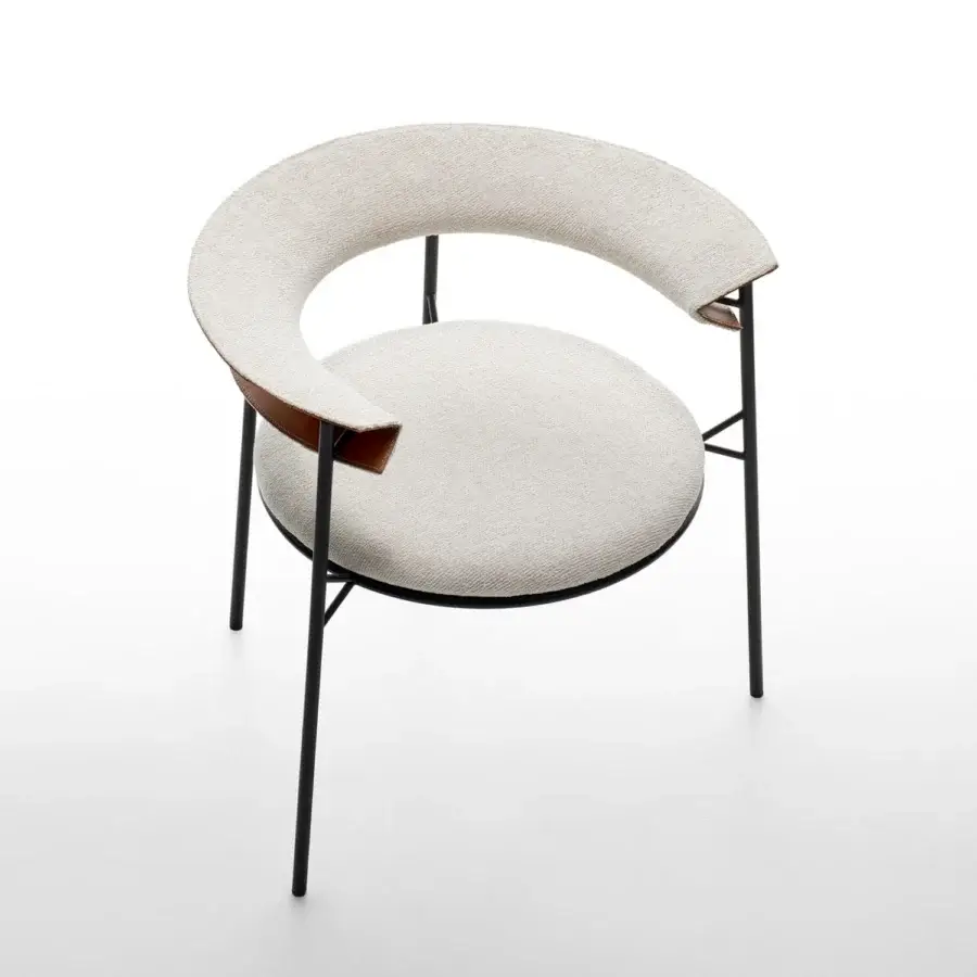 Elegant MDF Italia Cantle lounge chair with curved backrest upholstered in light cream woven textile and saddle leather detailing