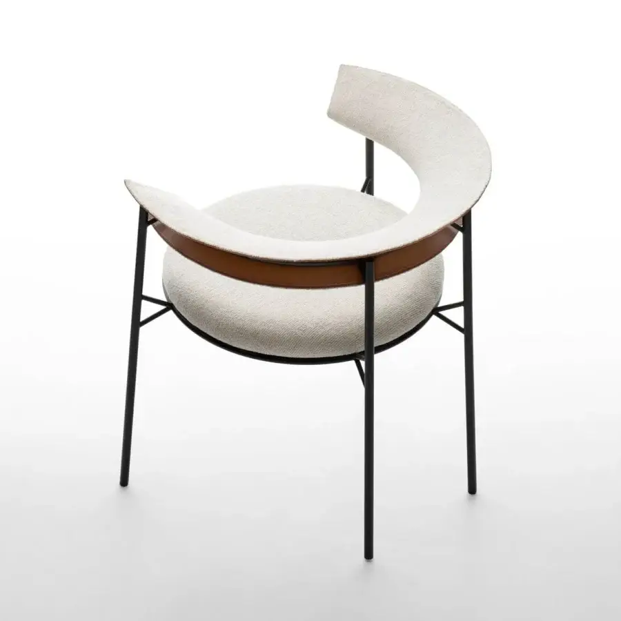 Distinguished MDF Italia Cantle lounge chair with curved textile upholstery and graphite grey powder-coated steel frame with saddle leather detailing