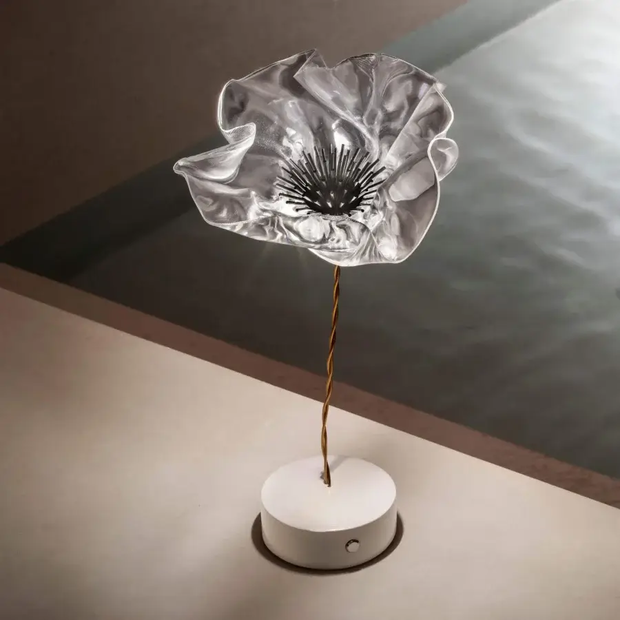 Exceptional Slamp LaFleur Battery lamp hand-molded in clear Lentiflex with a brass-color stem and matte white base