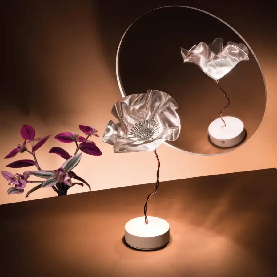 Distinguished Slamp LaFleur Battery lamp hand-molded in Lentiflex with a twisted copper wire stem and matte white base