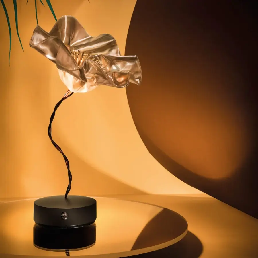 Distinguished Slamp LaFleur Battery lamp sculpted from hand-molded Lentiflex® with a glossy translucent shade and black twisted wire stem