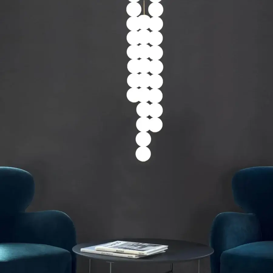Distinguished Terzani Abacus multi light suspension lamp with cascading brass and satin white glass diffusers exhibiting a luminous finish