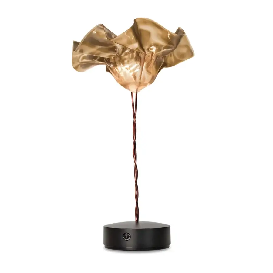 Exceptional Slamp LaFleur Battery lamp in warm translucent gold with a matte black magnetic base and delicate copper wire