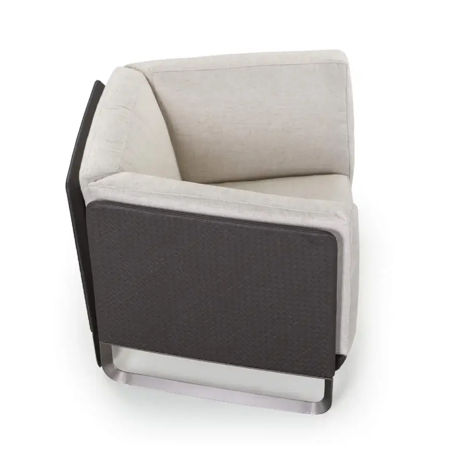 Elegant Turri Milano lounge chair with dark woven leather detailing and light beige fabric cushions with curved brushed nickel legs
