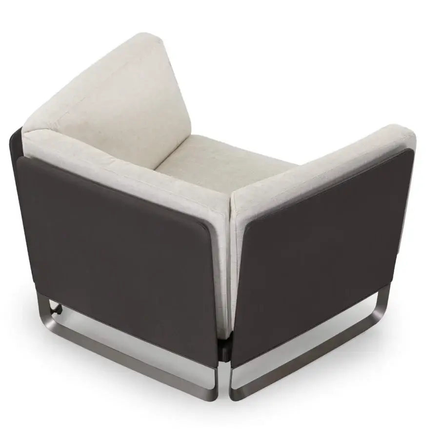Superior Turri Milano lounge chair with light cream textile upholstery and dark woven leather detailing built with curved brushed nickel legs