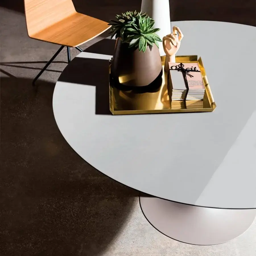 Elegant Sovet Italia Flute round table with light gray matte tempered glass and light pink lacquered metal base