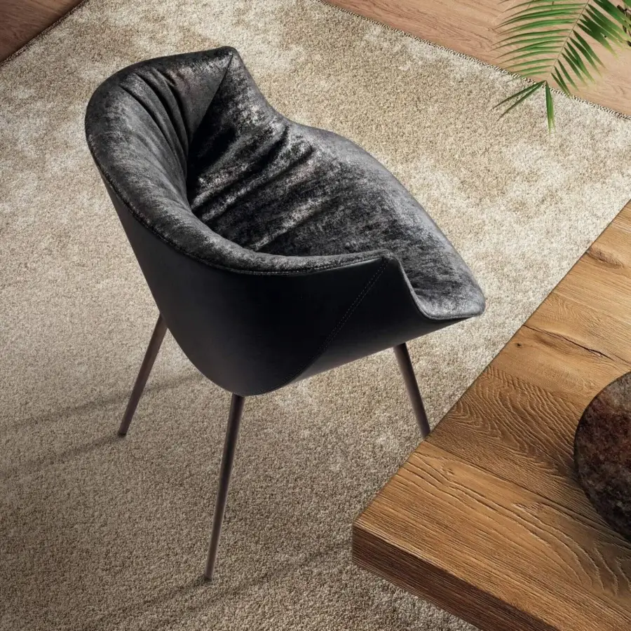Distinguished Lago Nacho armchair with dark grey textured upholstery and smooth matte black shell built with bronze-like metal legs
