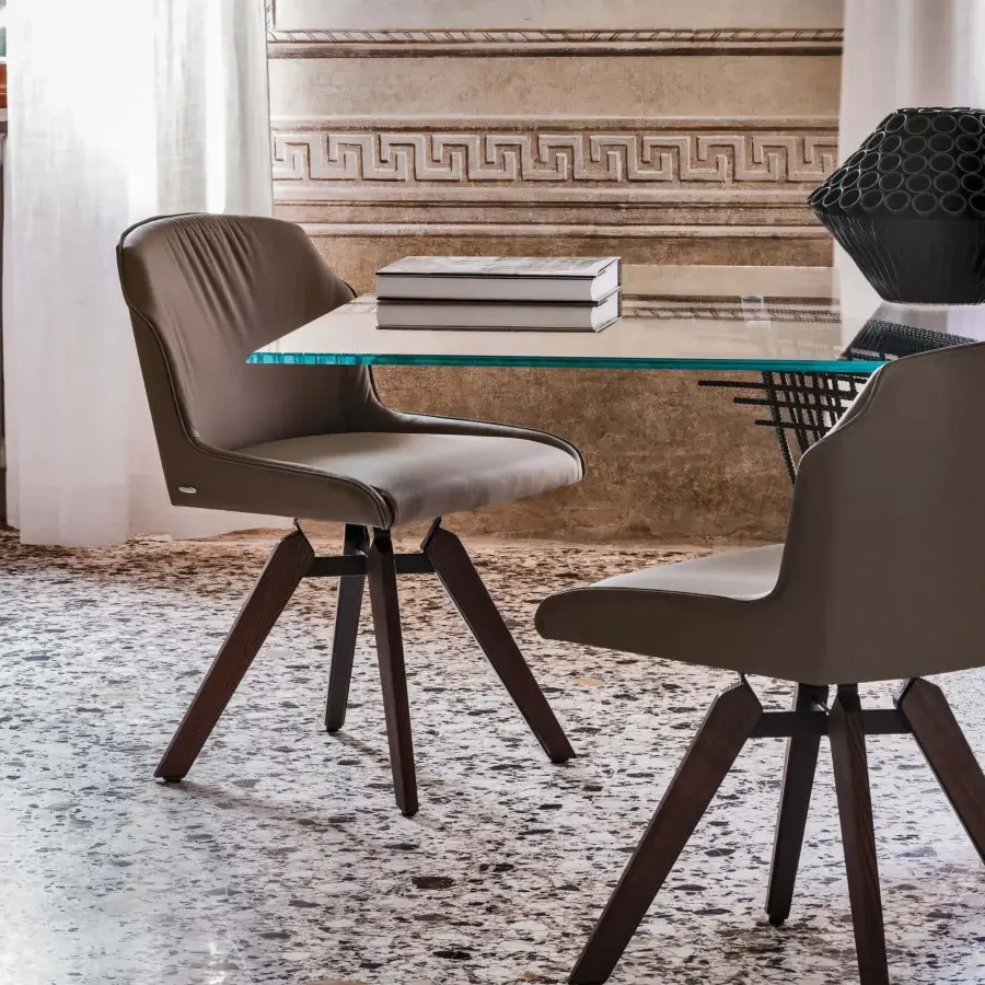 Exclusive Cattelan Italia Tyler chair with taupe upholstery, dark brown ashwood legs and pyramidal swivel base