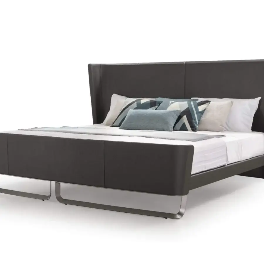 Distinguished Turri Milano bed with a tall angled headboard upholstered in dark gray fabric and curved metal base