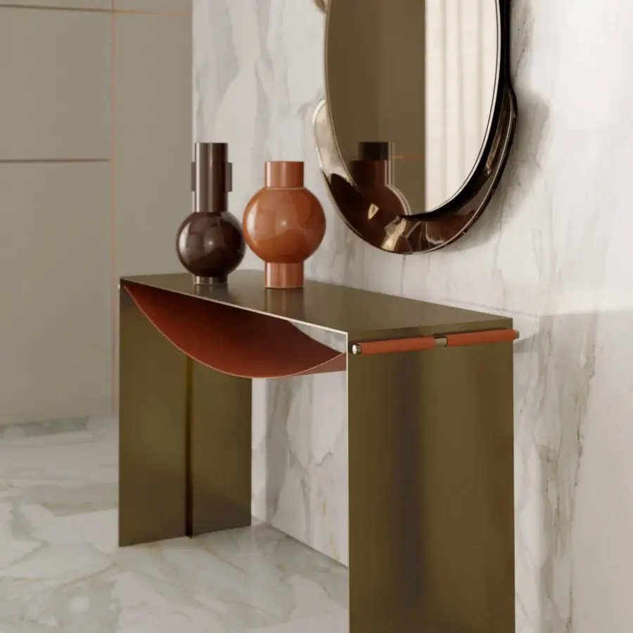 Elegant Bontempi Piper console with lightweight metal and curved orange-brown leather detail beneath the tabletop