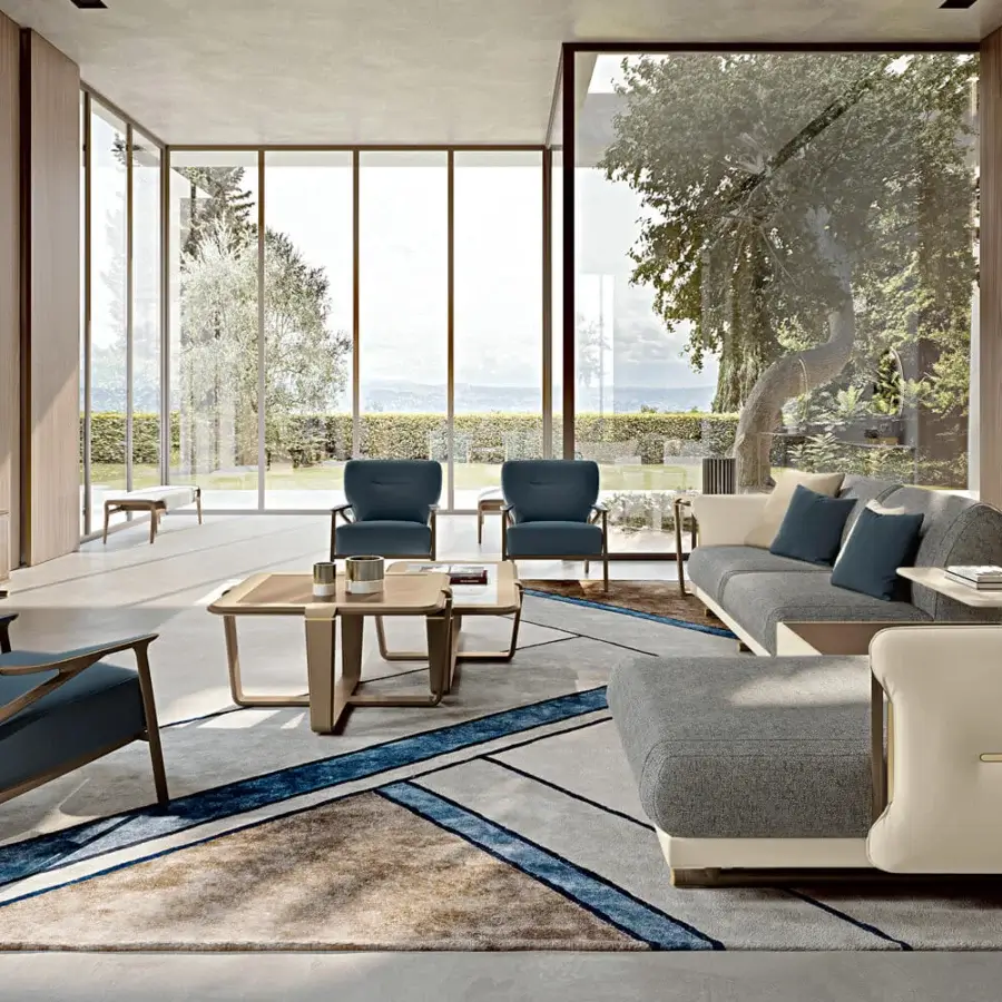 Distinguished Turri Vine lounge chair with solid blue textile upholstery and light-toned natural wood frame crafted in Italy