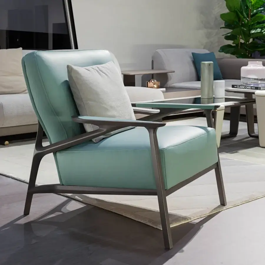 Superior Turri Vine lounge chair in muted light blue leather with a branched natural wood structure and dark finish