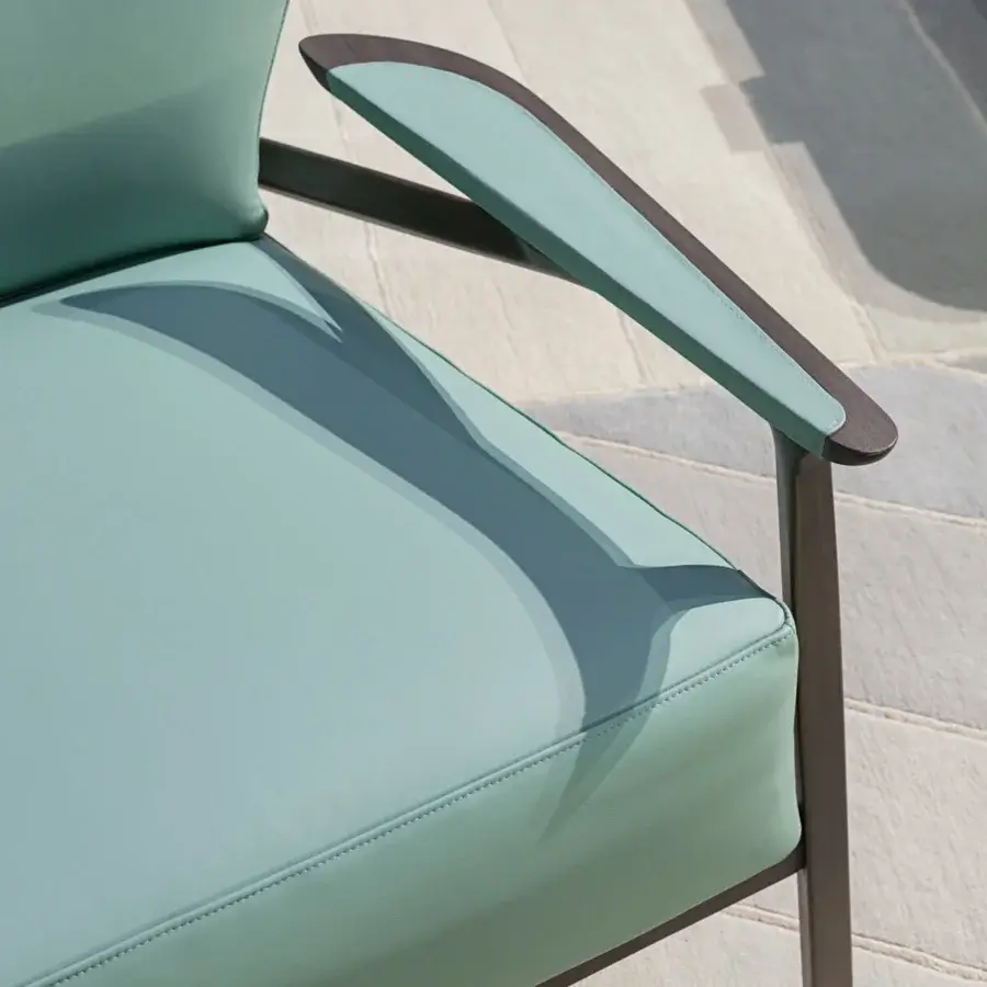 Exceptional Turri Vine lounge chair with branched natural wood structure and light greenish-blue fabric upholstery with a matte finish