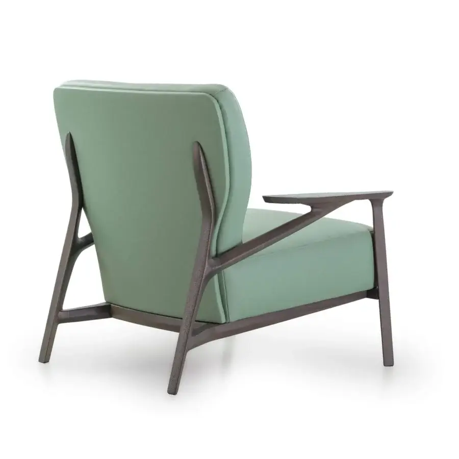 Distinctive Turri Vine lounge chair in light green textile with a dark-toned natural wood branched structure