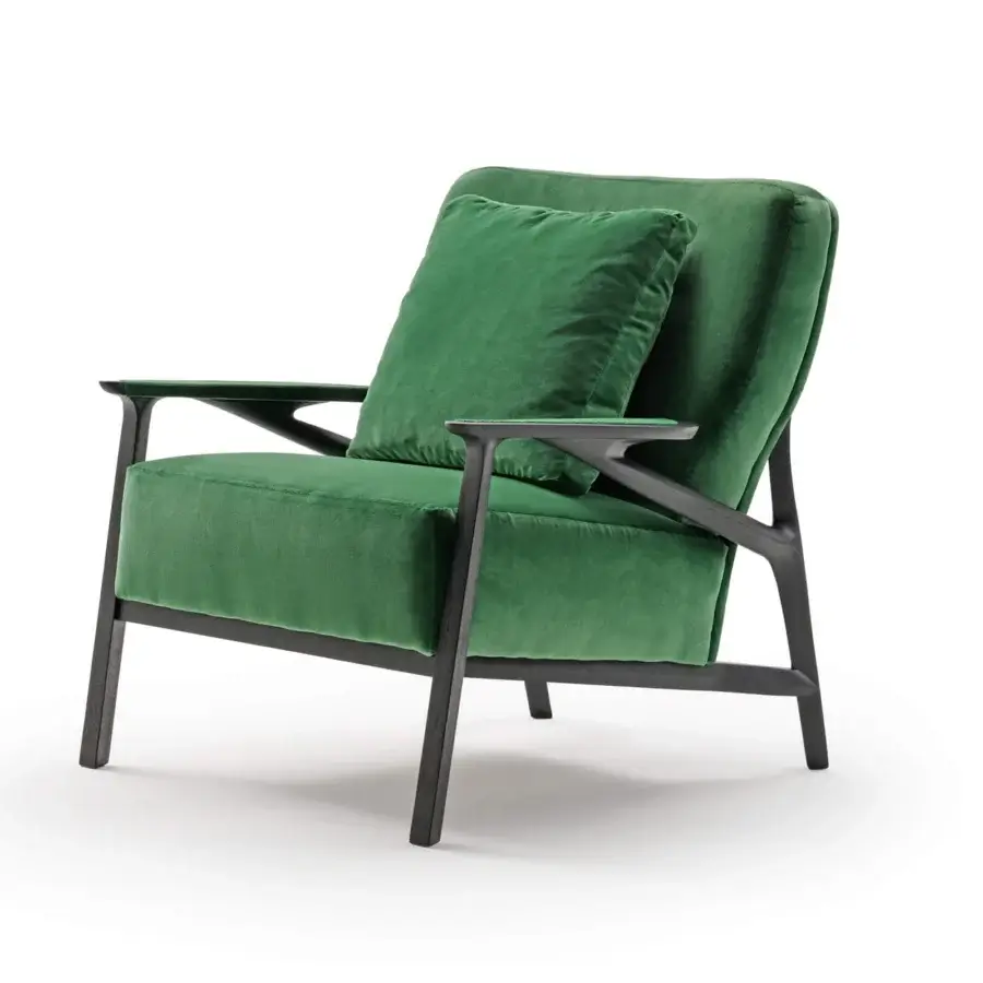 Elegant Turri Vine lounge chair with branched wood structure and lush green velvet upholstery in a dark-toned matte finish