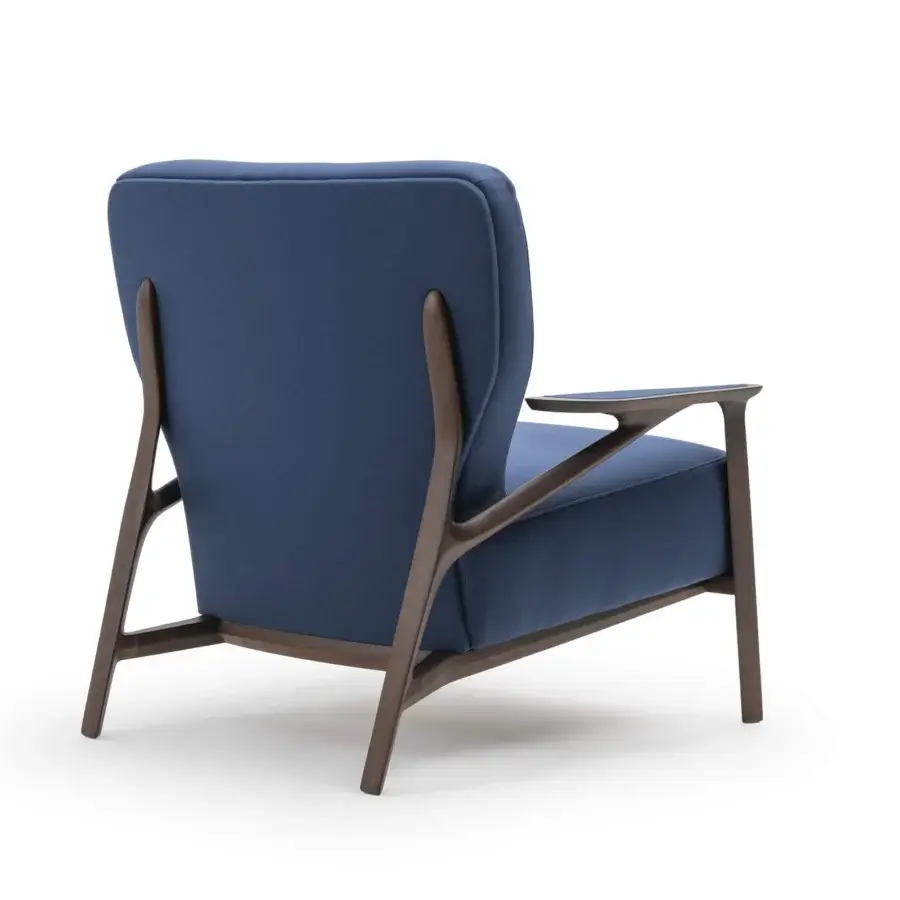 Exceptional Turri Vine lounge chair in deep blue woven fabric with dark-toned natural wood frame crafted in Italy