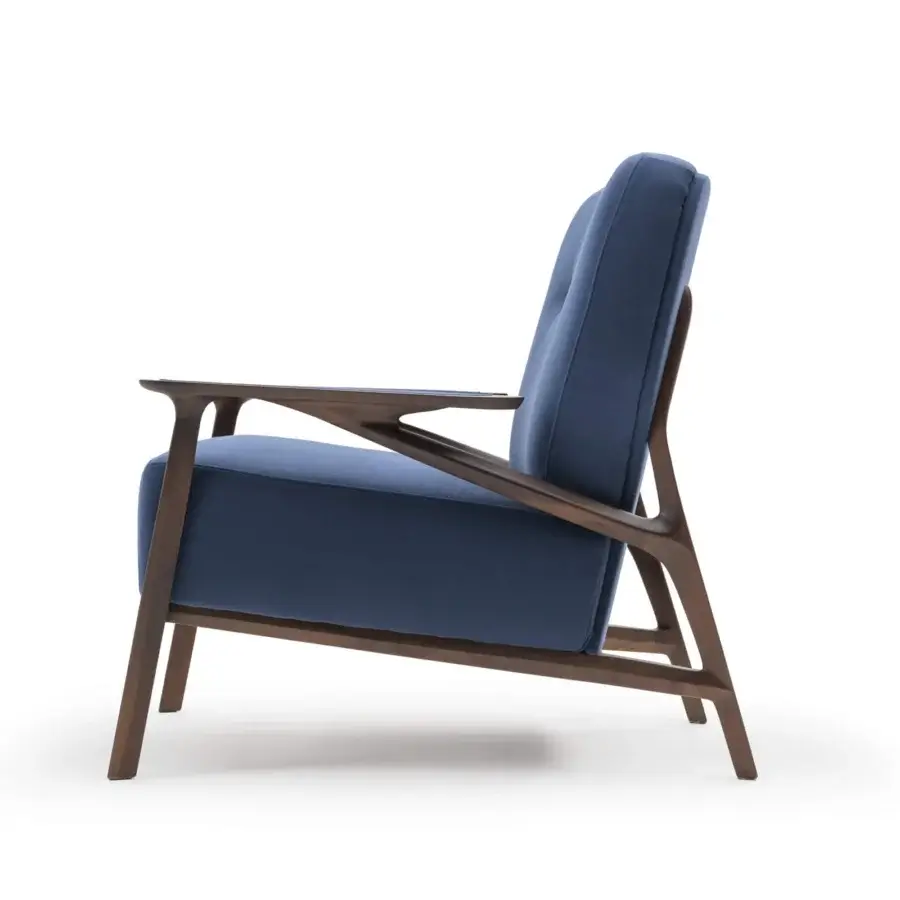 Distinguished Turri Vine lounge chair with branched natural wood and vibrant blue textile upholstery creating a contemporary aesthetic
