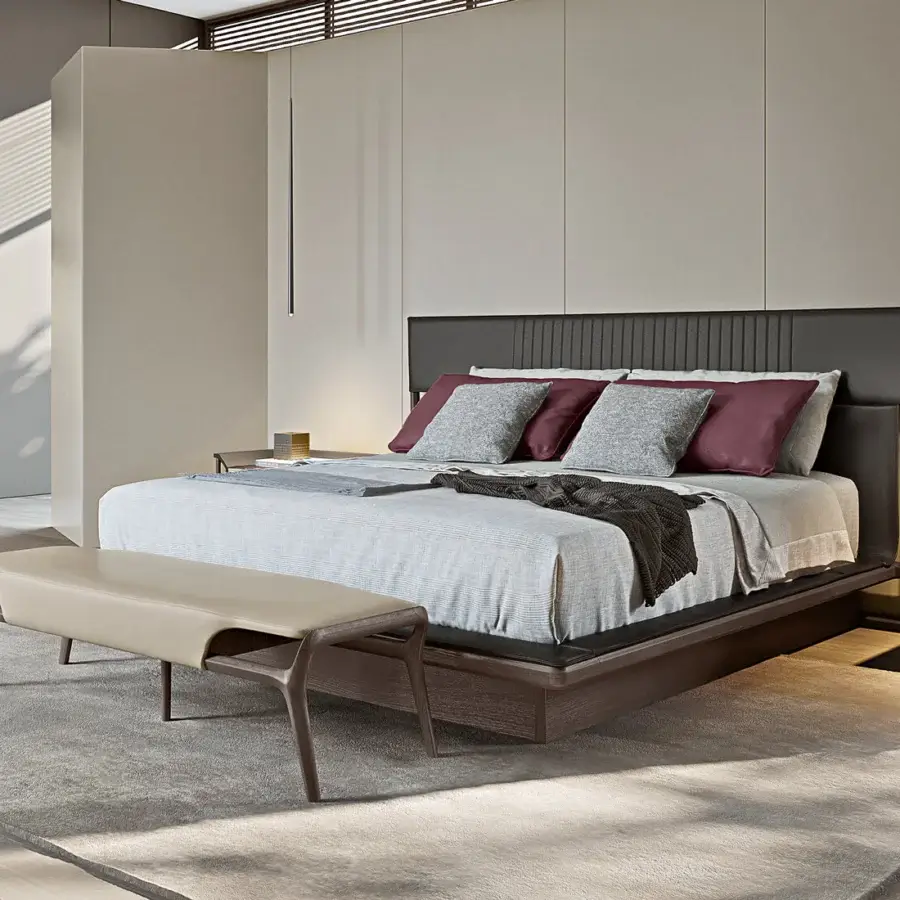 Exceptional Turri Vine bench crafted in dark brown wood with a supple, light tan leather seat exhibiting sinuous curves