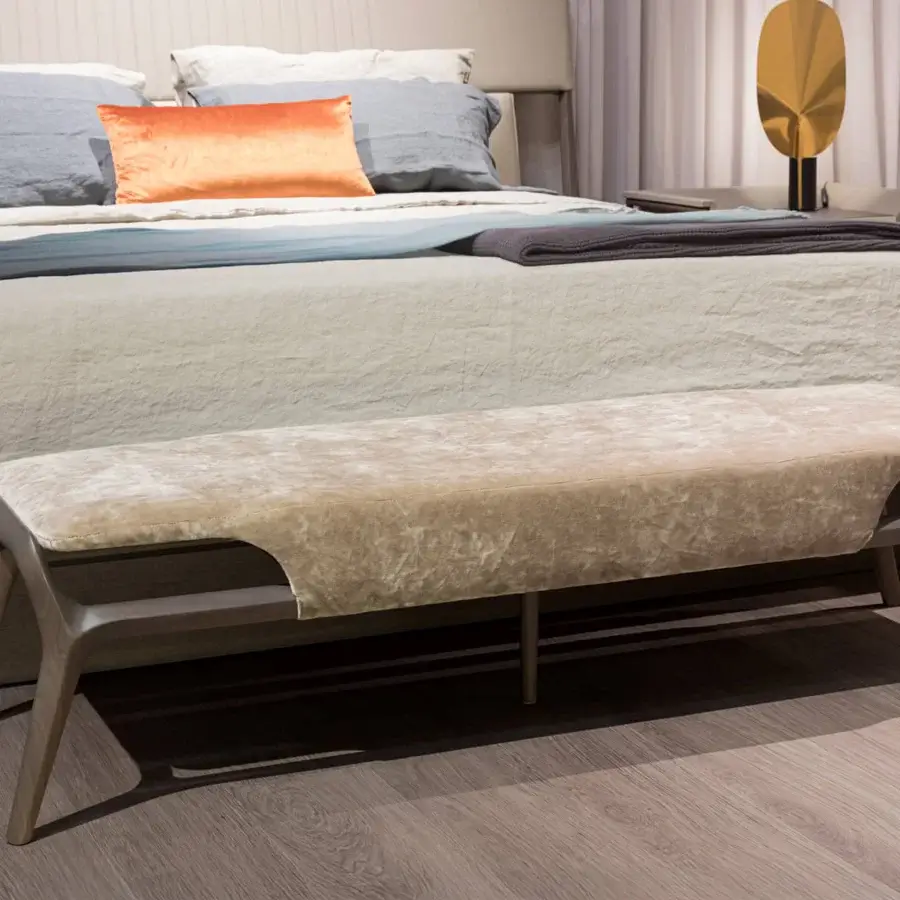 Elegant Turri Vine bench with sinuous natural wood and fully covered light beige, velvet-like textile construction